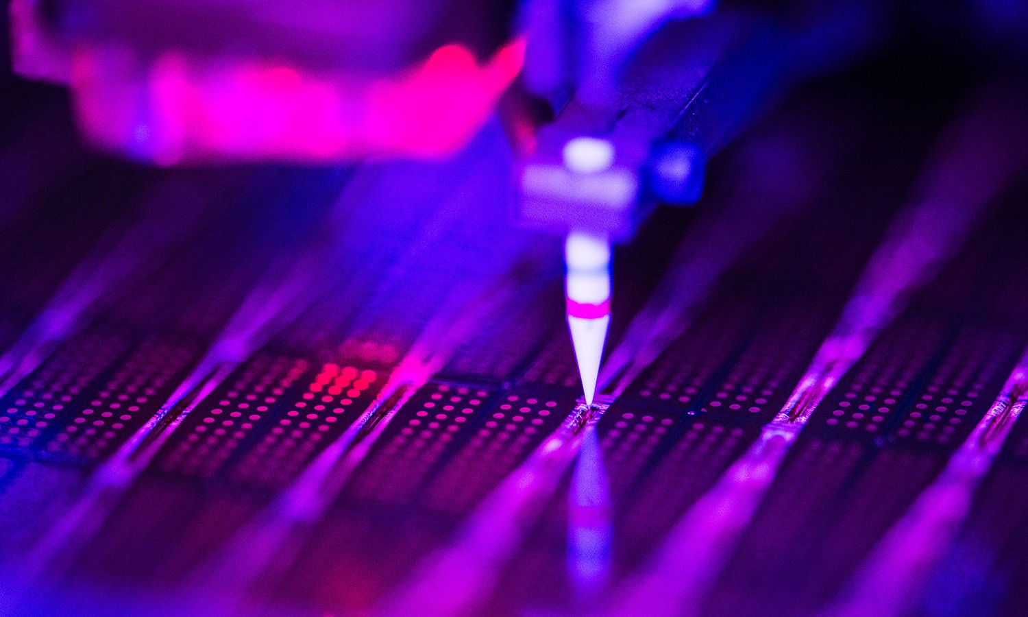 Close-up of semiconductor process using precision tool